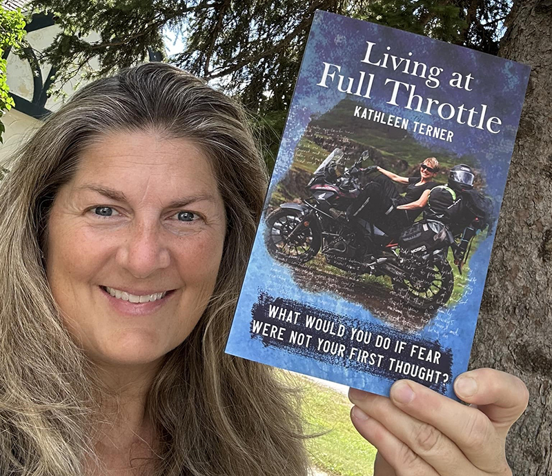02 Michele holding book Michelle Lamphere WIMA President